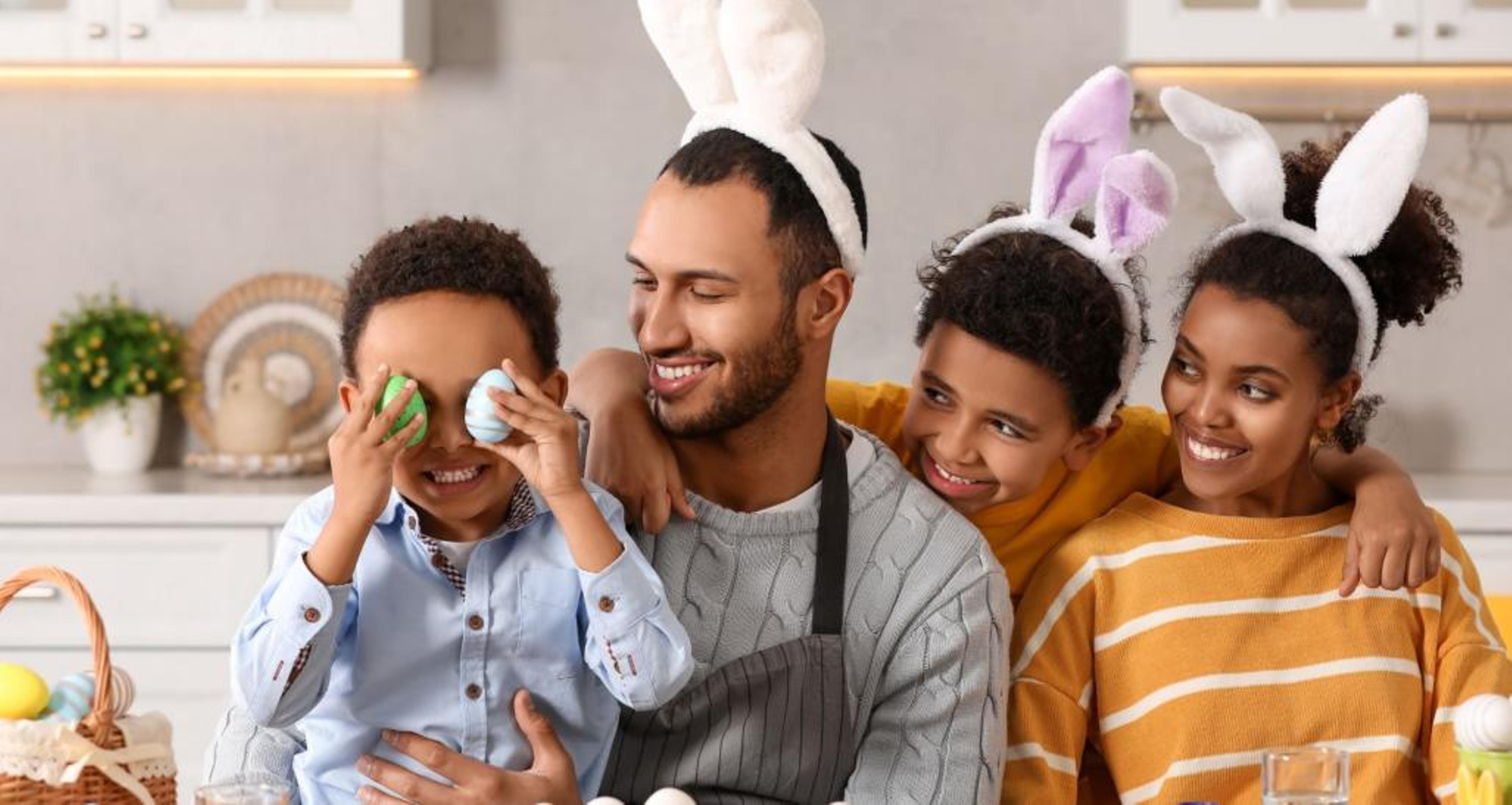 Family painting Easter eggs.