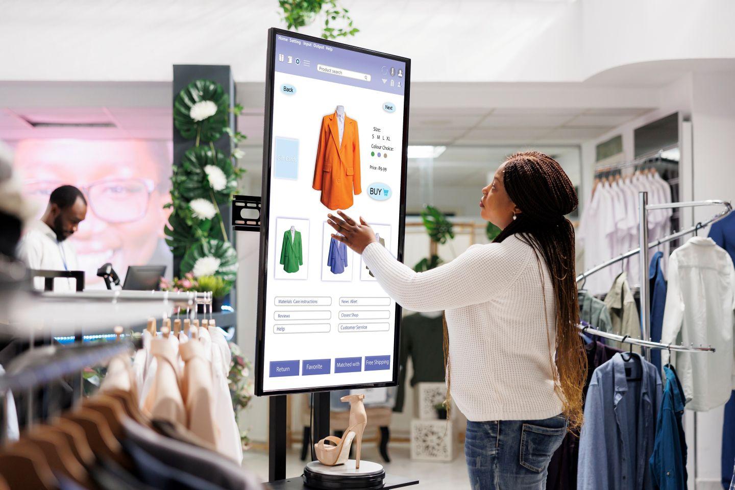A woman using technology to help shop in-store.